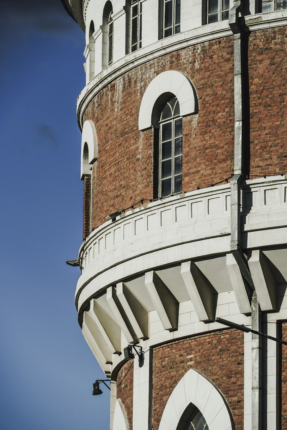 brown brick building under blue sky during daytime