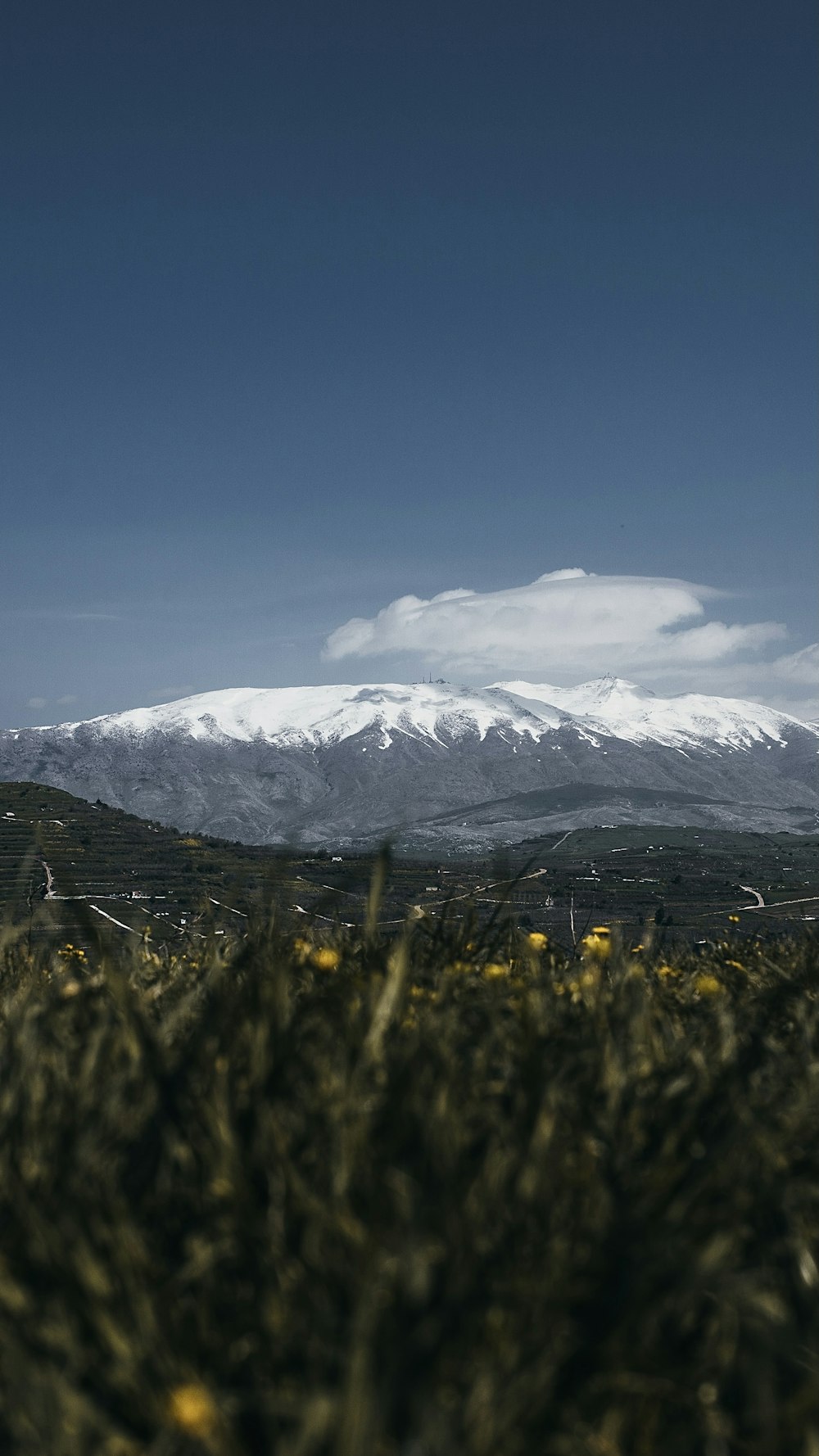 snow covered mountain under blue sky during daytime