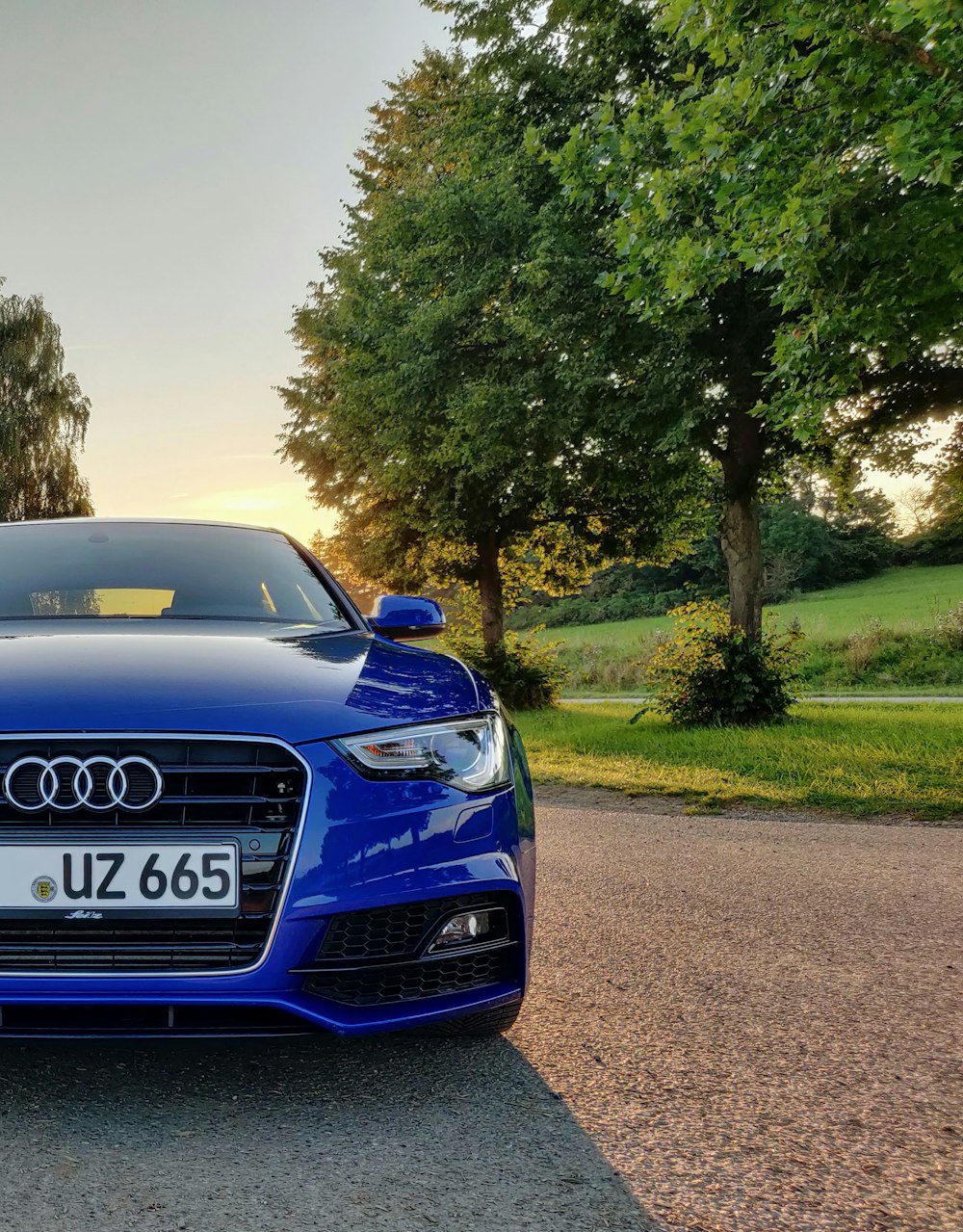 blue audi a 4 on road during daytime