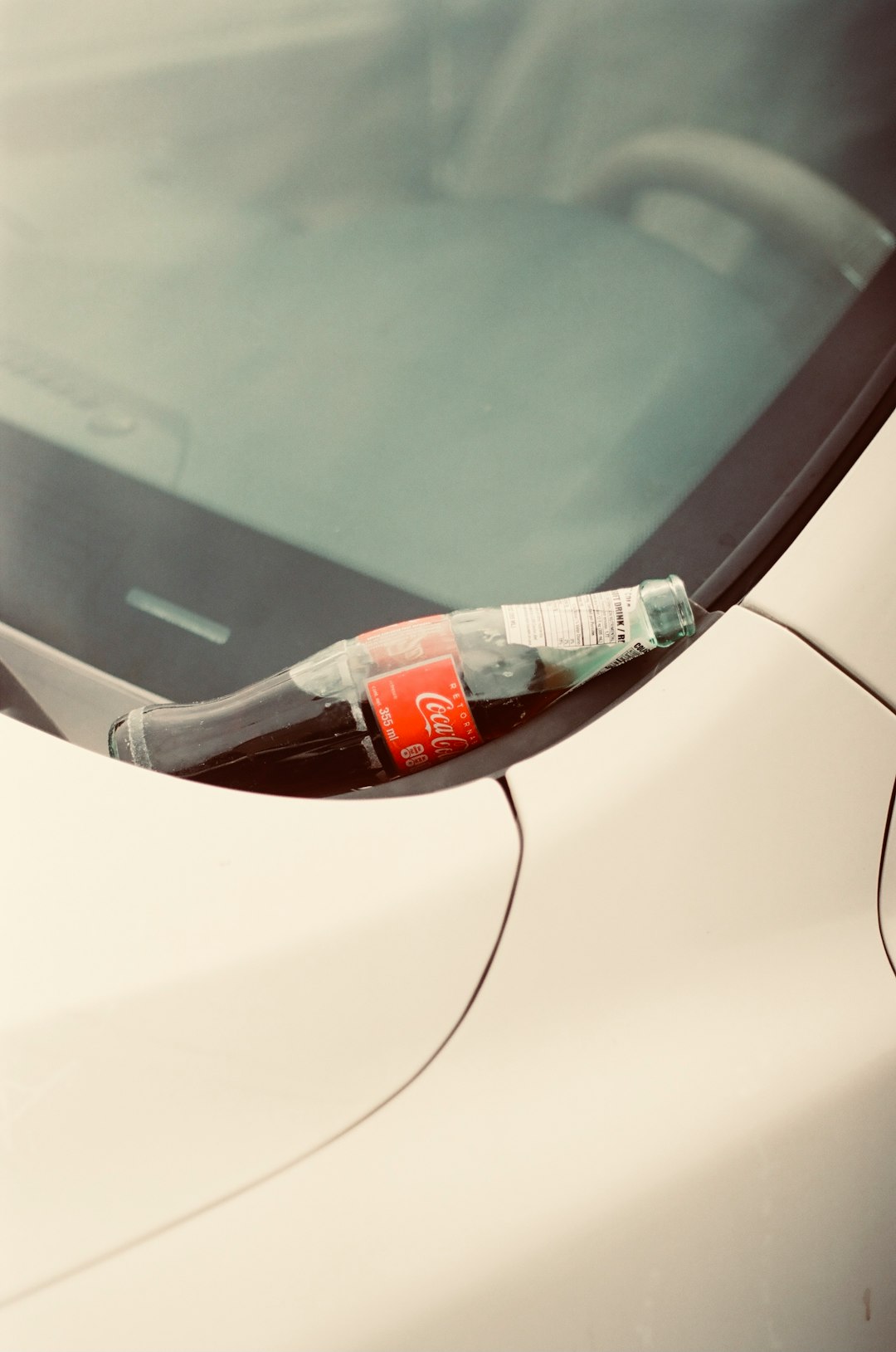 white and red labeled plastic bottle