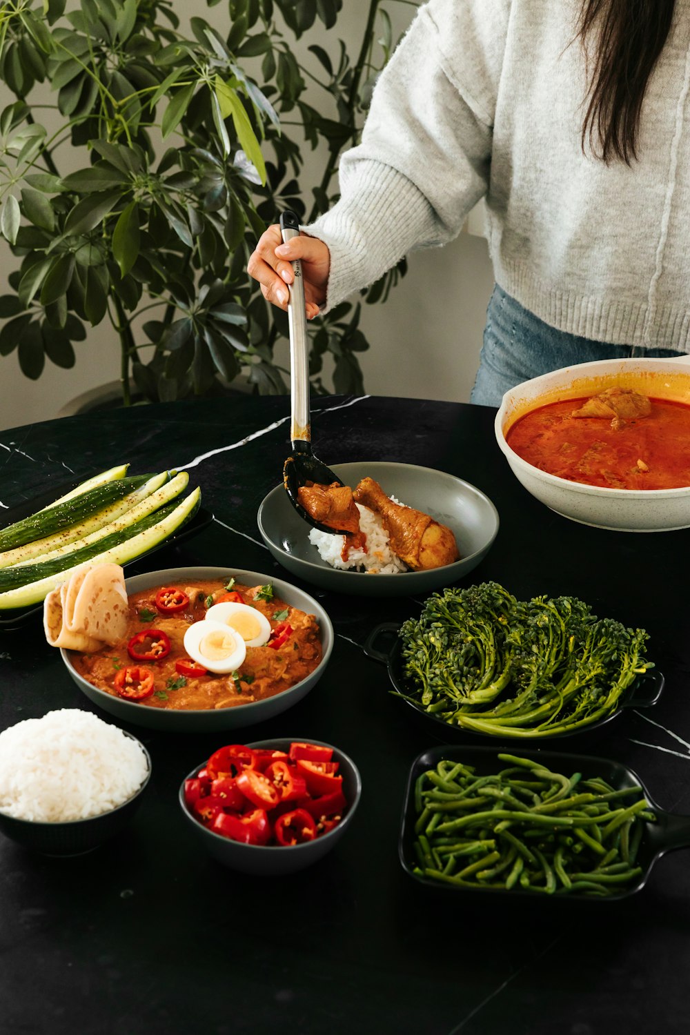 person holding stainless steel spoon and fork