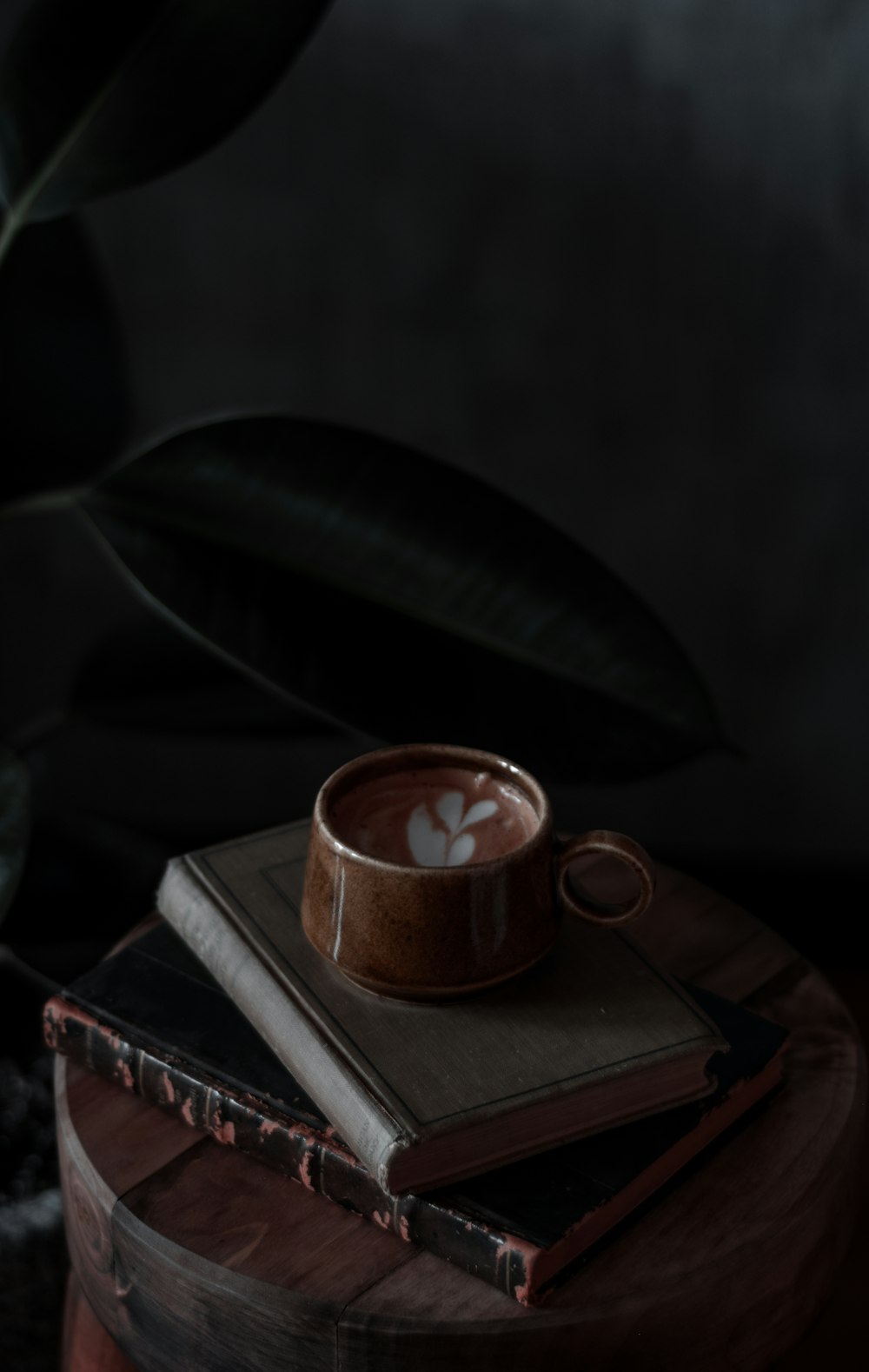 brown ceramic mug on book