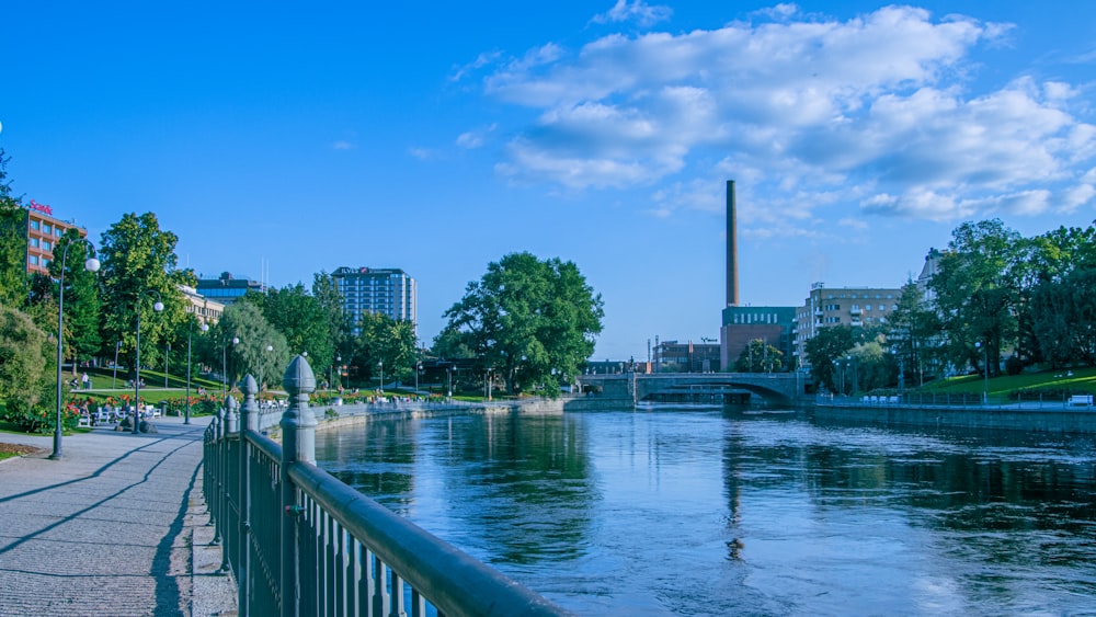 a river running through a city next to a bridge