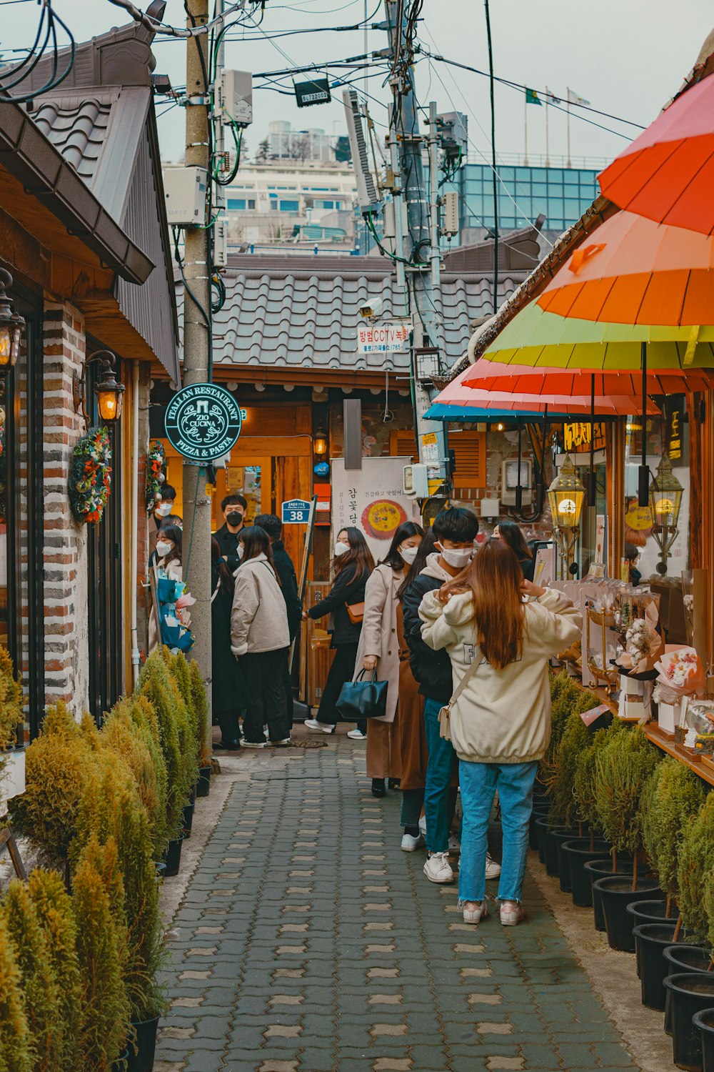 people walking on sidewalk during daytime