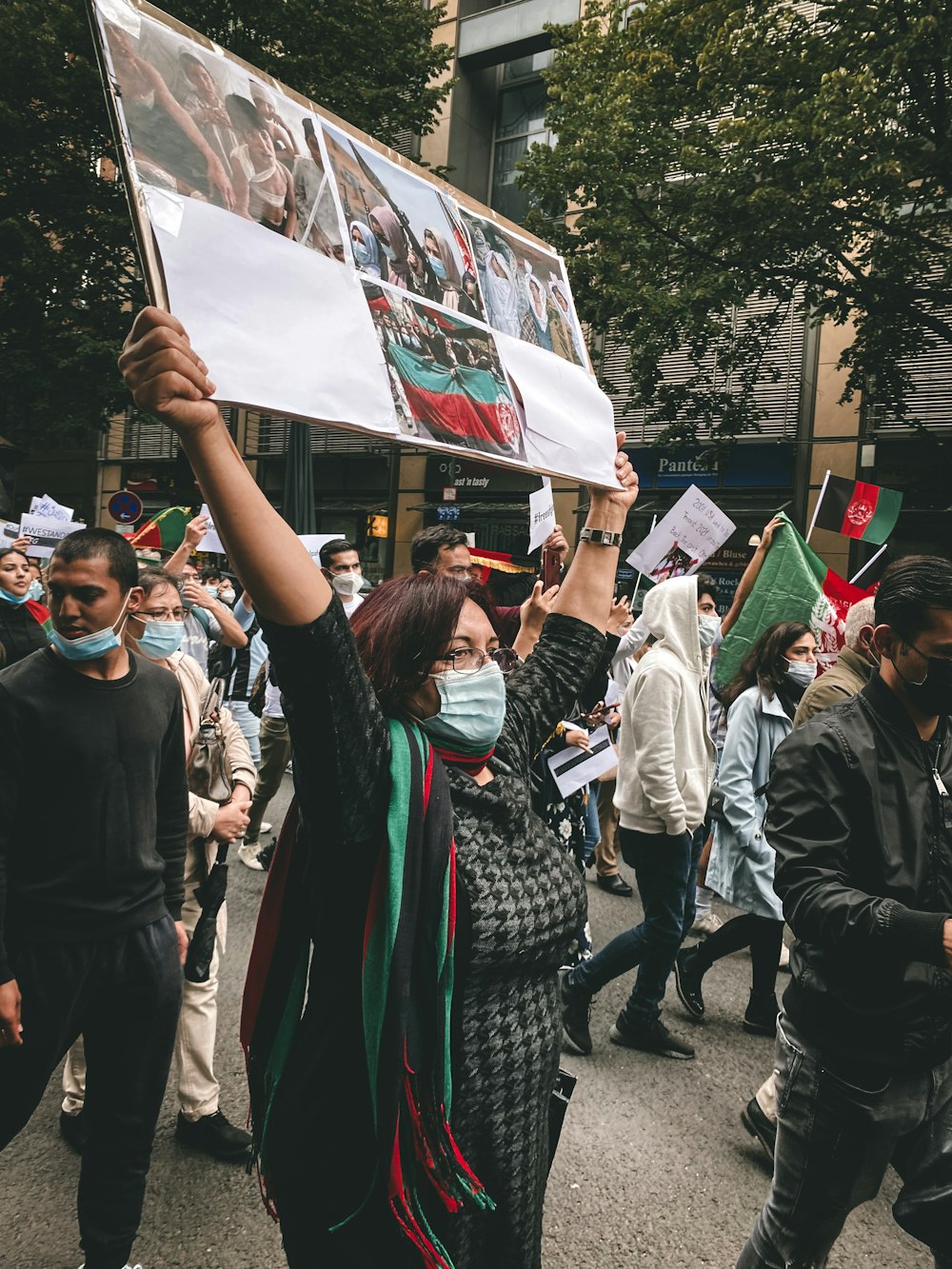 people holding banner during daytime