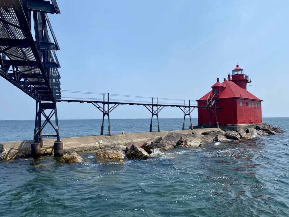 red and white concrete building near body of water during daytime