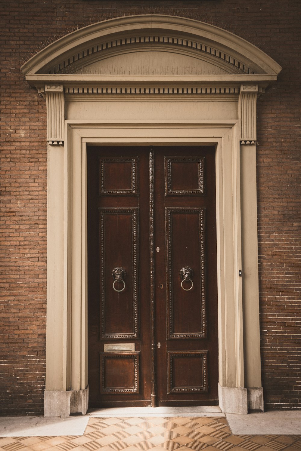 brown wooden door with brass door knob