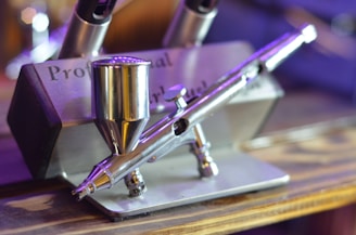 silver and purple airbrush sprayer