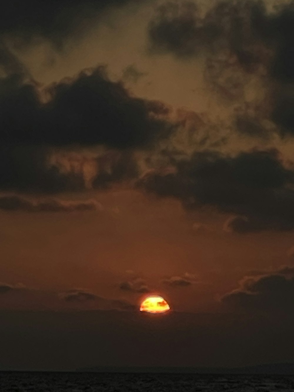 sun over the clouds during sunset