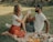 A happy couple enjoying a picnic in a park.
