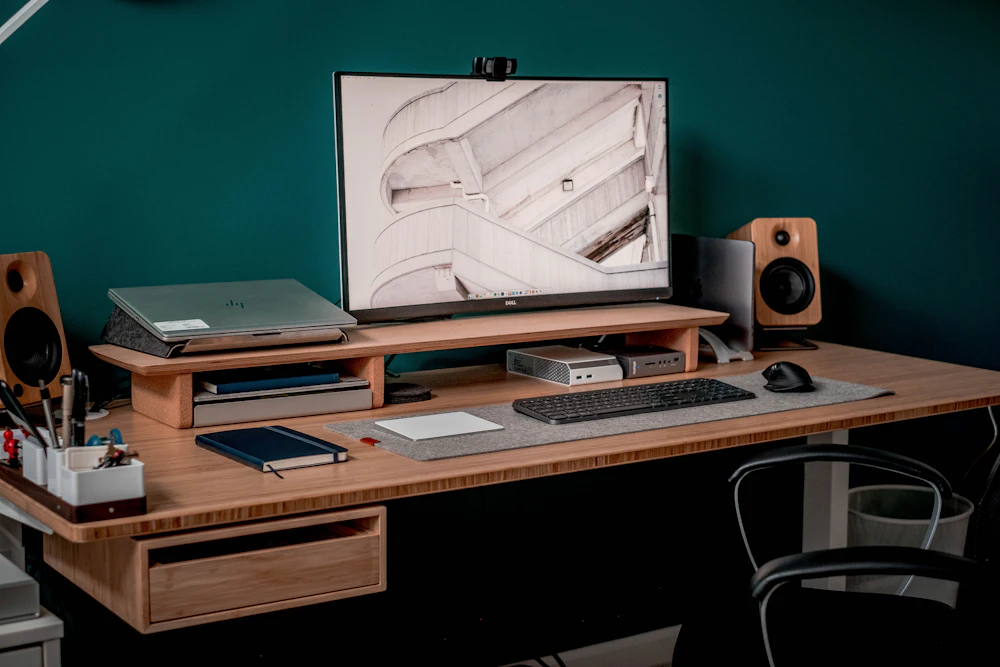 Modern office with organized desks, monitors, and clean cable management