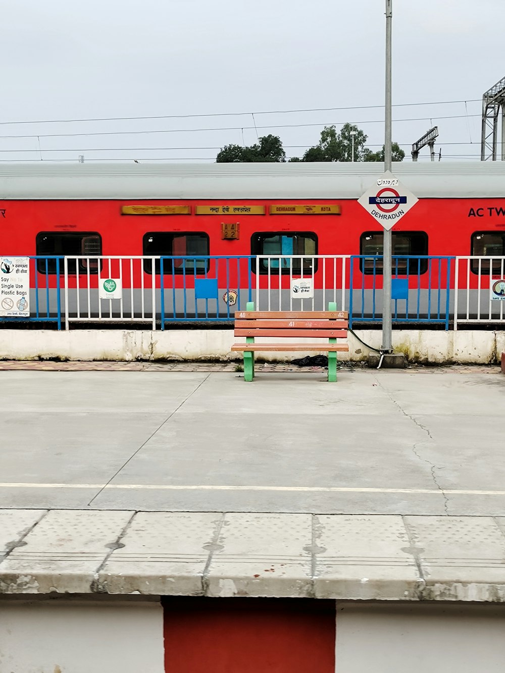 red and white train on rail during daytime