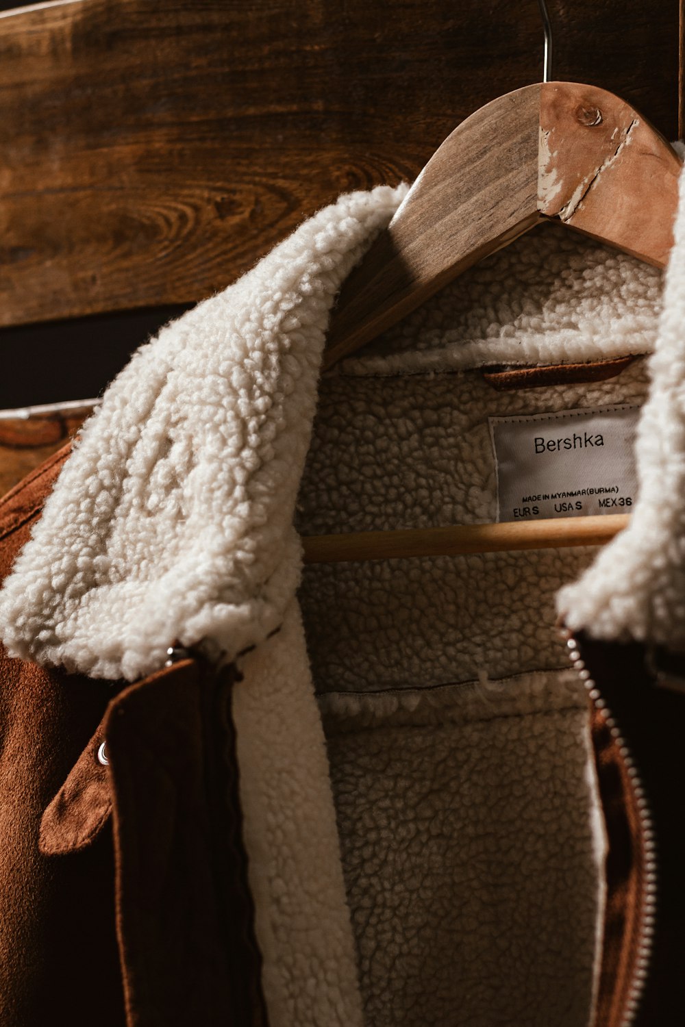 white textile on brown leather bag