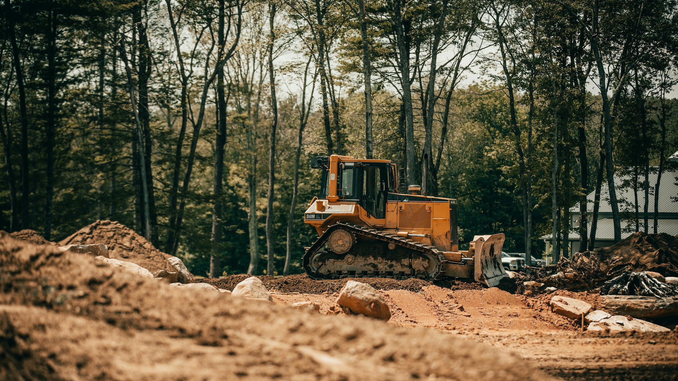 A dozer digging in a rocky area