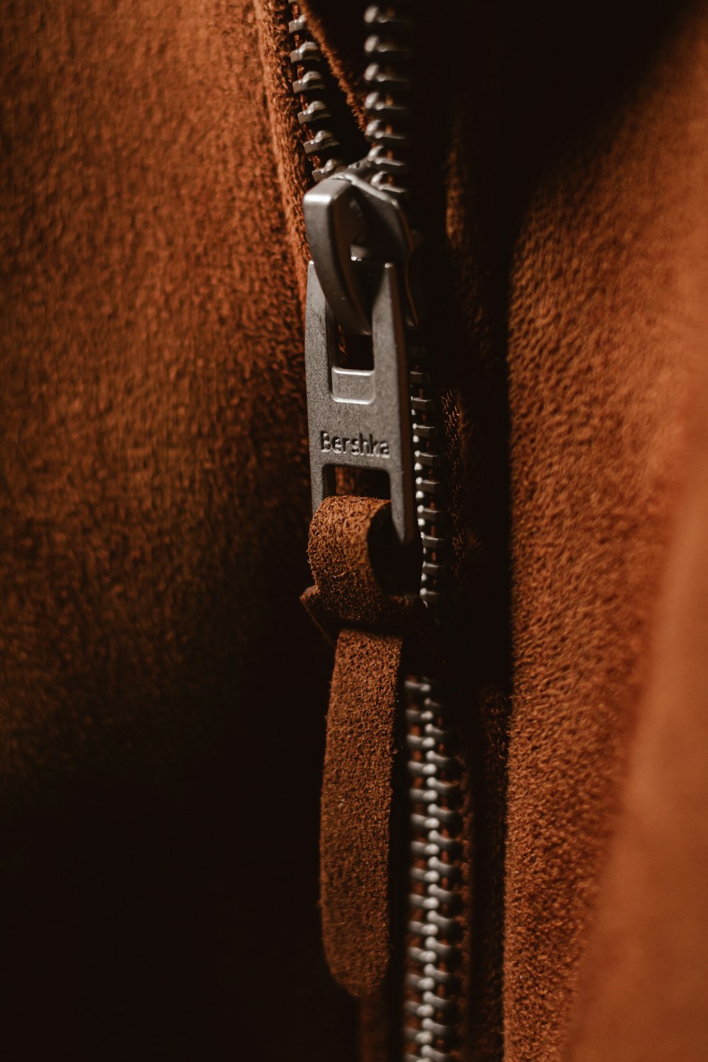 black strap on brown textile