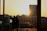 A smiling couple enjoying the sunset on the balcony of a modern apartment in Saranda.