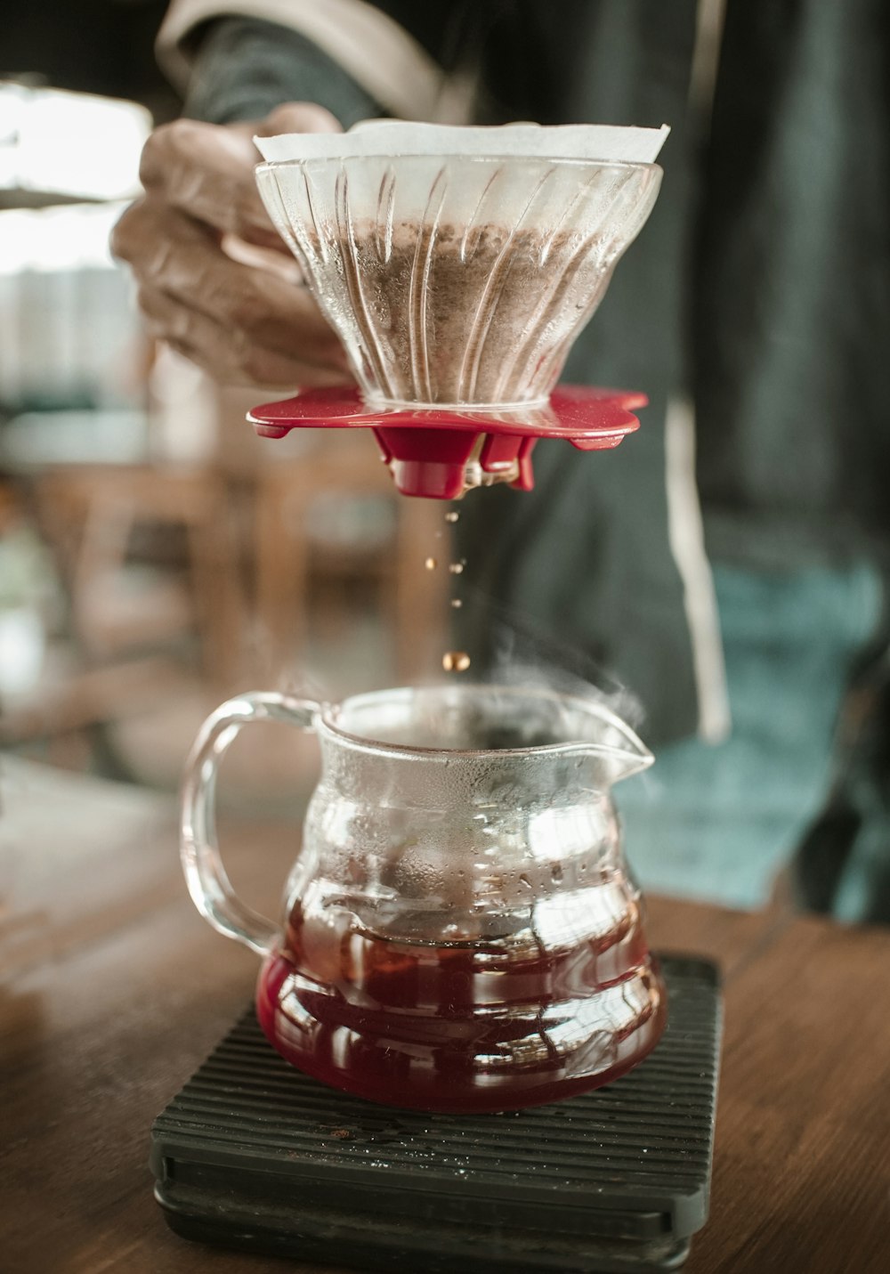 clear glass pitcher with red liquid