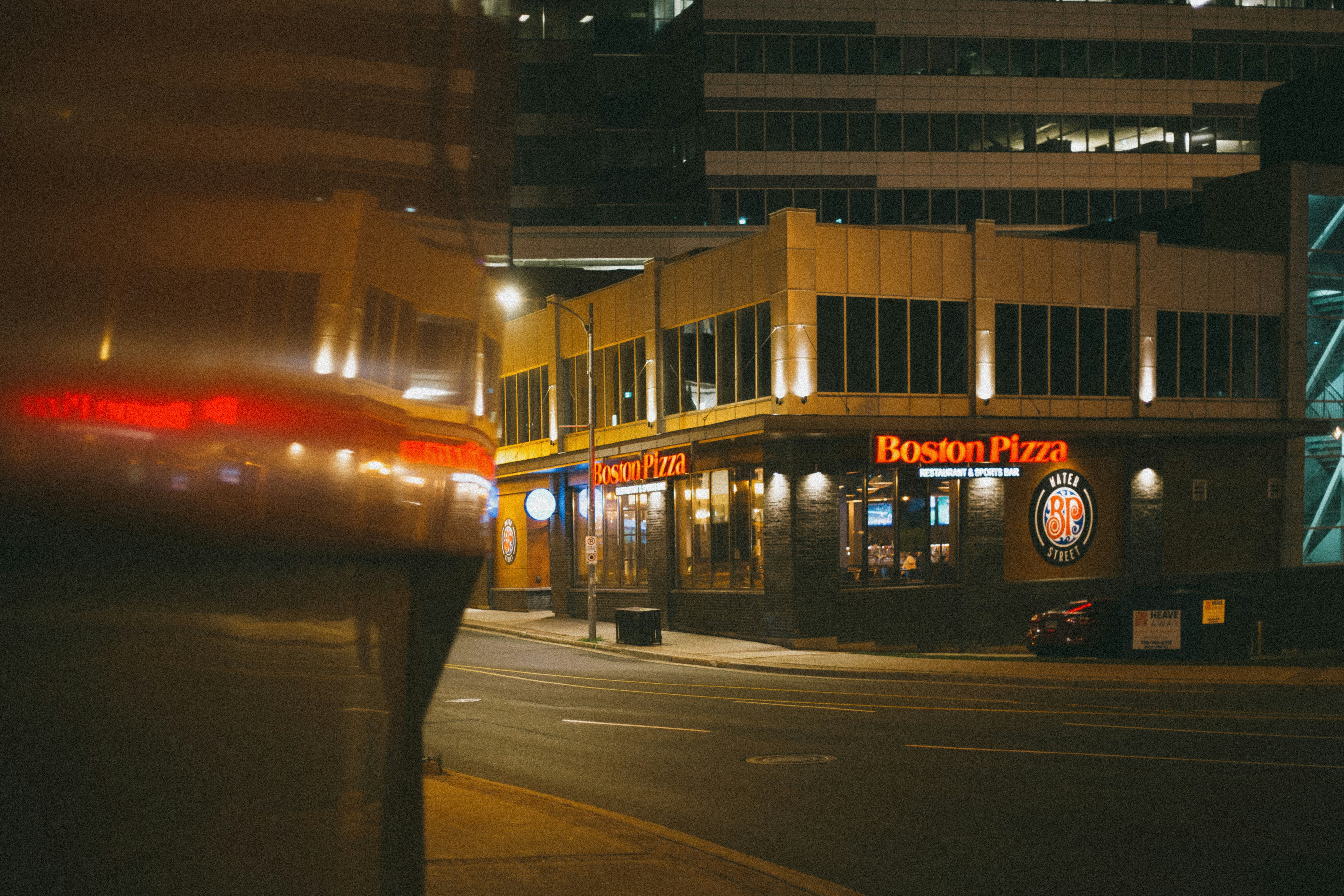 red and white lighted building during night time, 