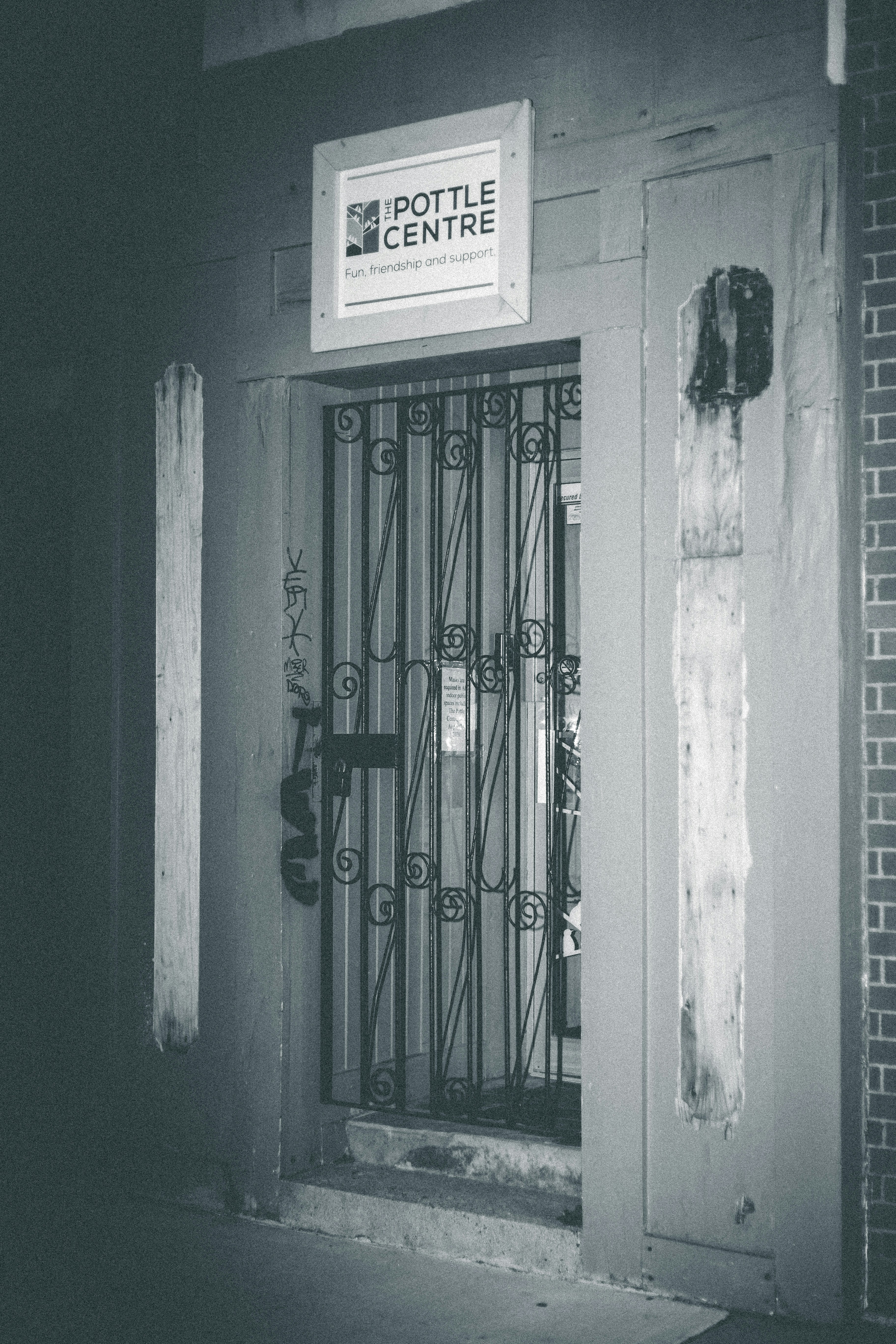 black metal gate on white wall