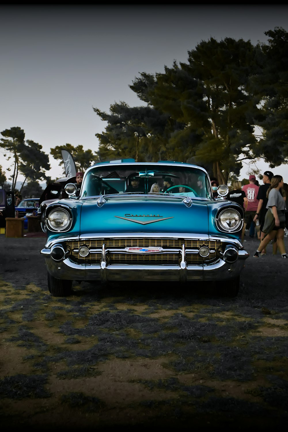 blue classic car on road during daytime