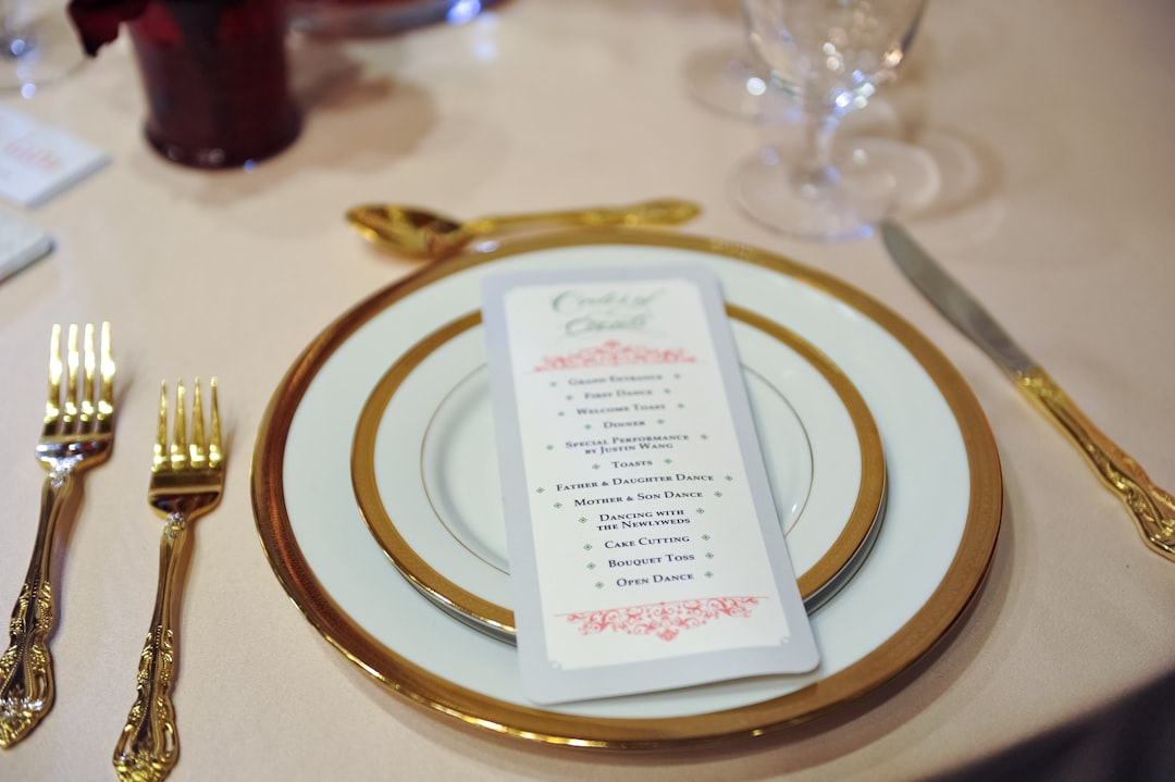 white and gold round plate on table