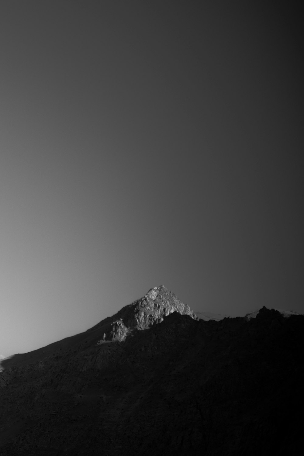 grayscale photo of snow covered mountain