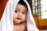 girl covered with white towel