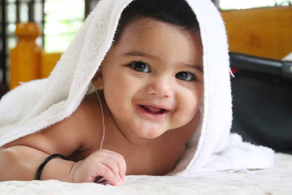 girl in white towel on head