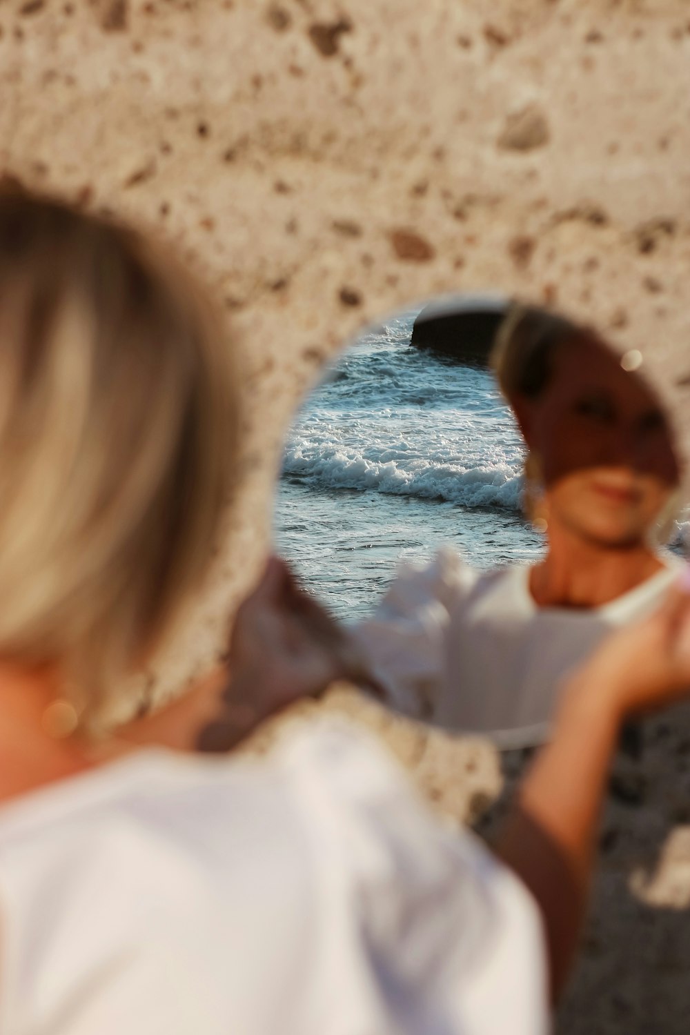 woman in white shirt sitting beside woman in white shirt