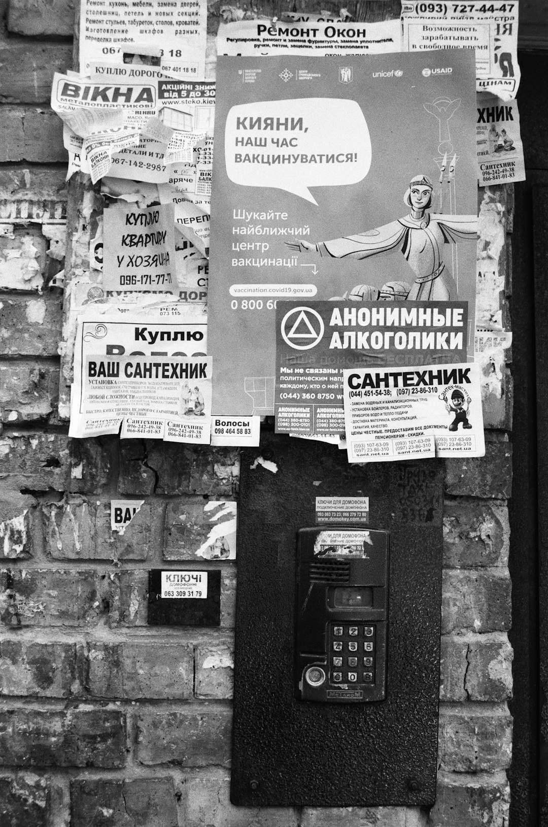 grayscale photo of telephone booth