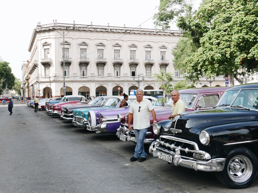 cars parked on street near building during daytime