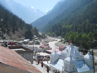 people walking on street near mountain during daytime