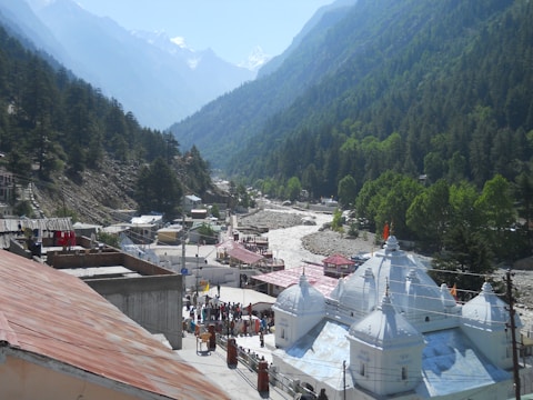 people walking on street near mountain during daytime