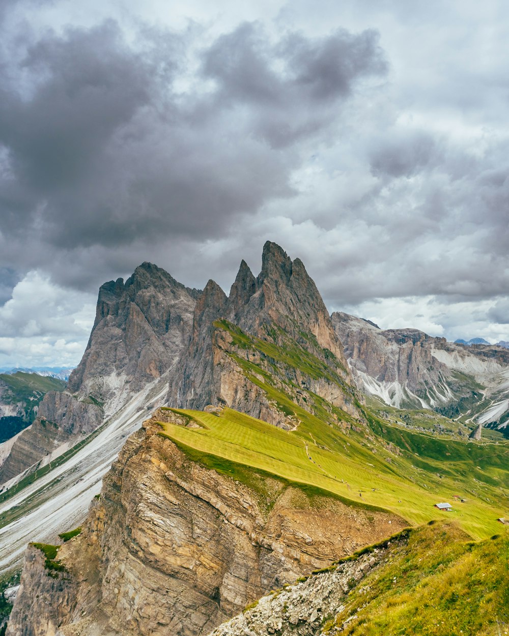 green and brown mountain under cloudy sky during daytime