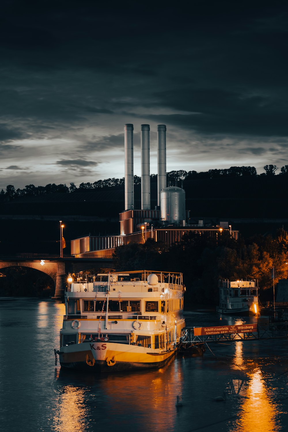 white and brown ship on water during night time