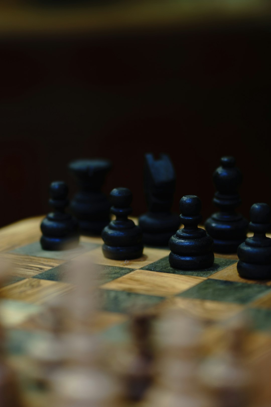 black chess pieces on chess board