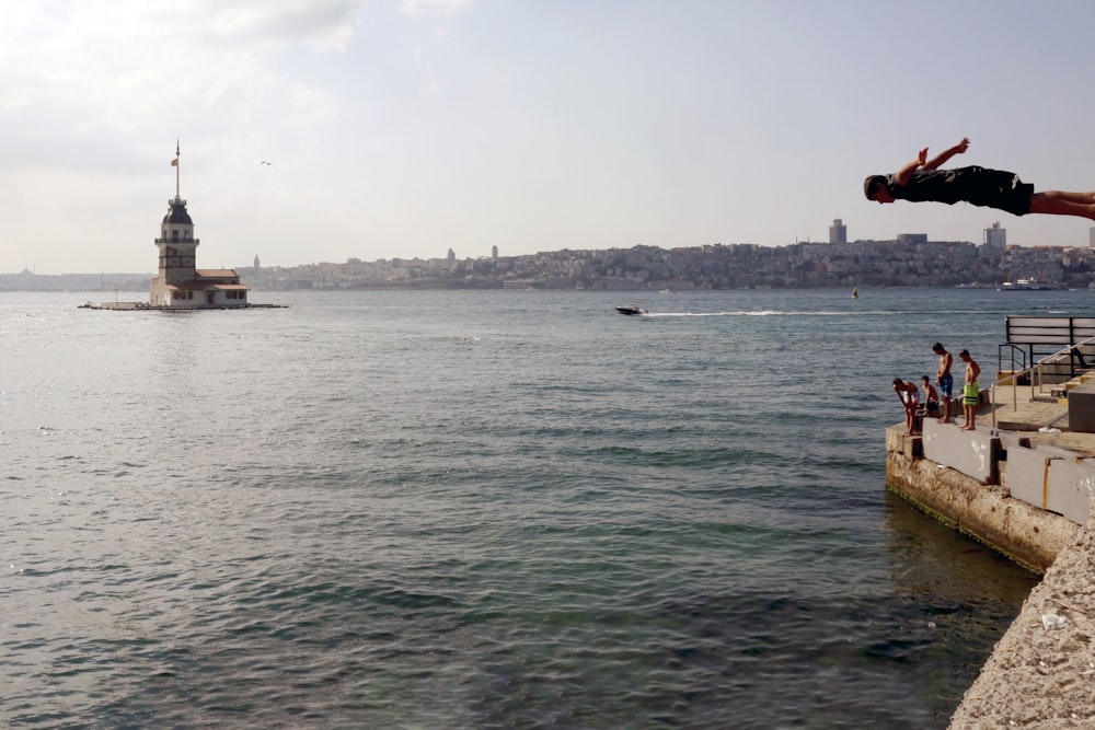 body of water near city buildings during daytime