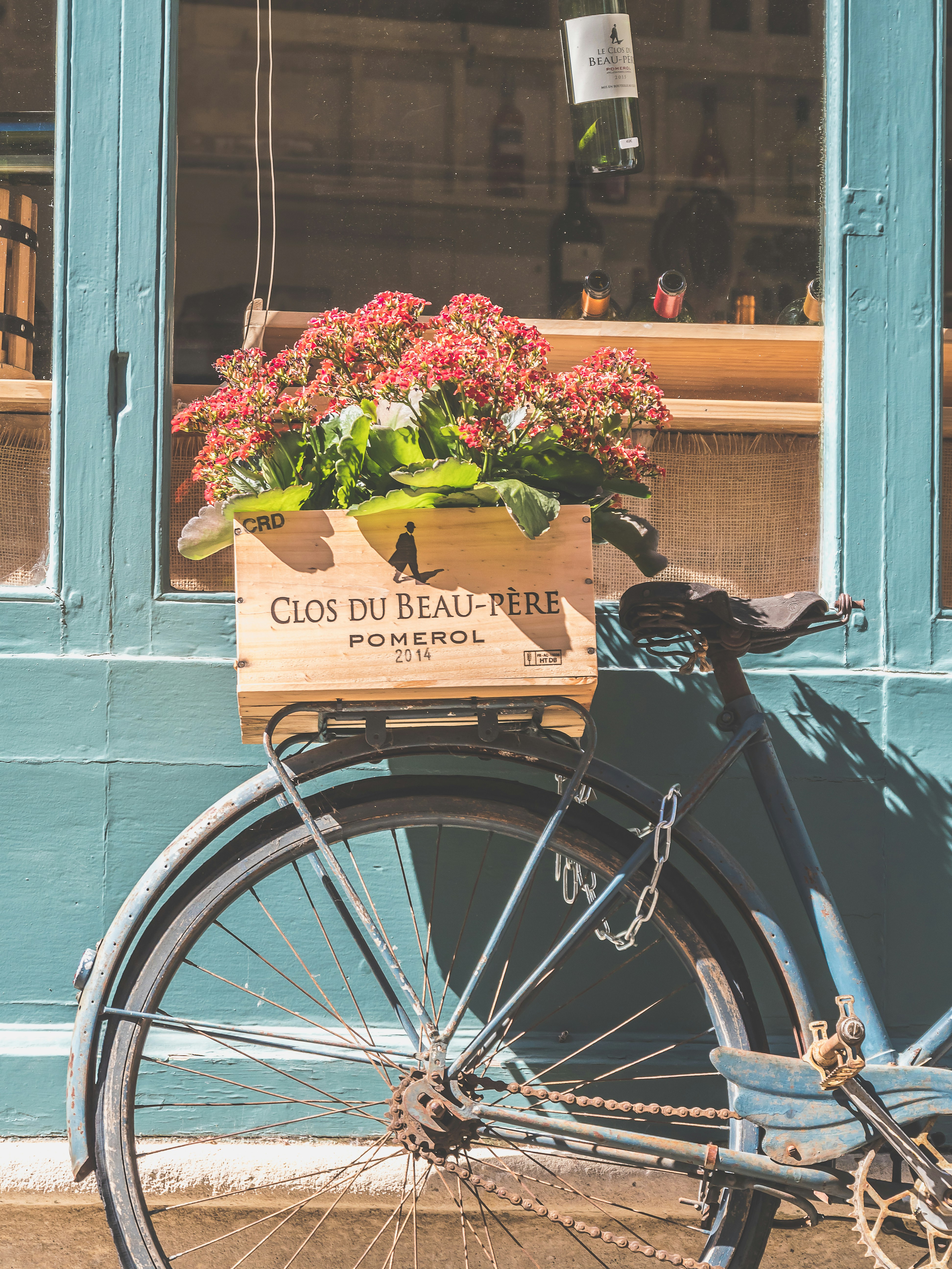 black bicycle with flowers on the window