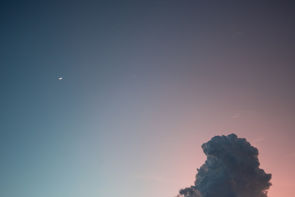 silhouette of mountain under blue sky during daytime