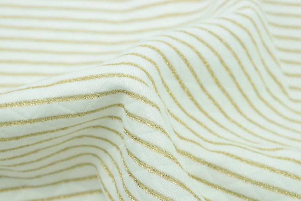 white and yellow stripe textile