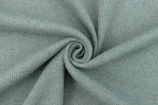 Artistic shot of a fabric roll displaying the subtle Fibonacci spiral texture.