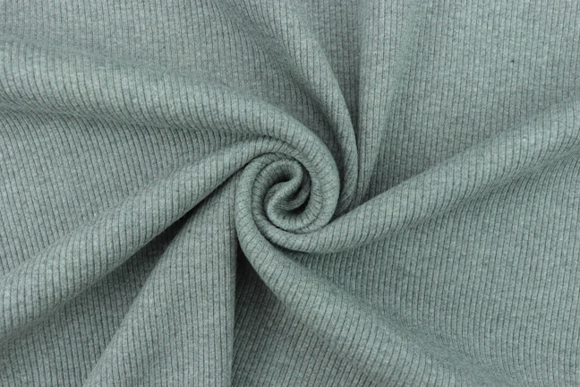 Artistic shot of a fabric roll displaying the subtle Fibonacci spiral texture.
