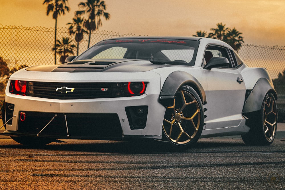 white chevrolet camaro on road during daytime