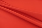 red textile in close up photography