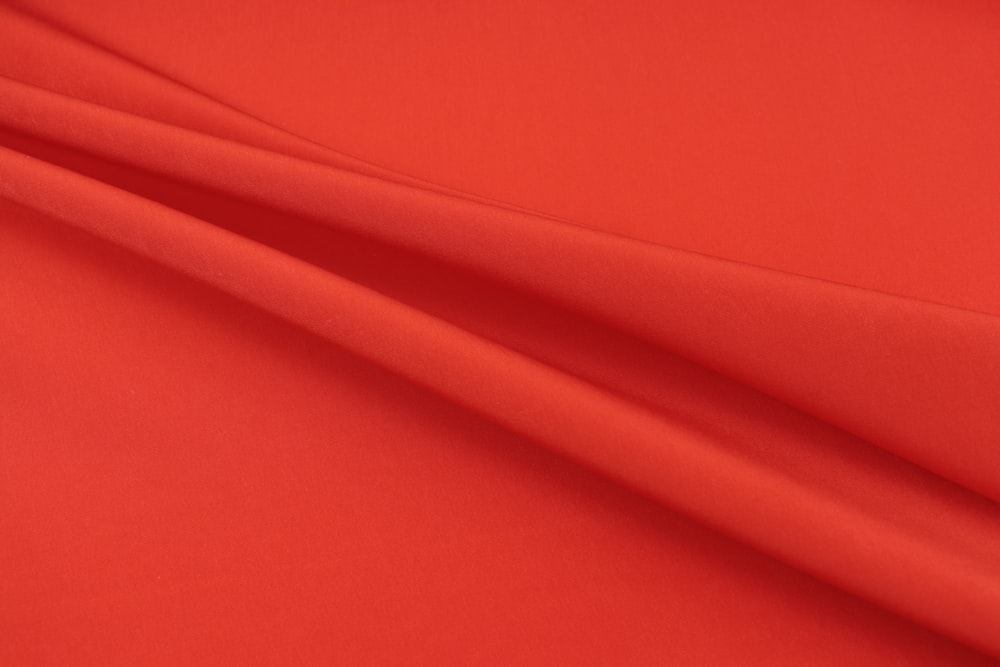 red textile in close up photography