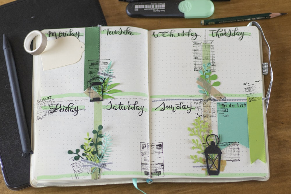 green and black floral on white book page
