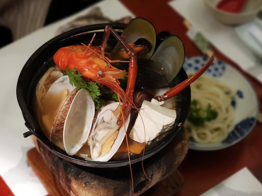 cooked food on black ceramic bowl