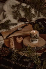 brown and white pine cone and brown wooden cross