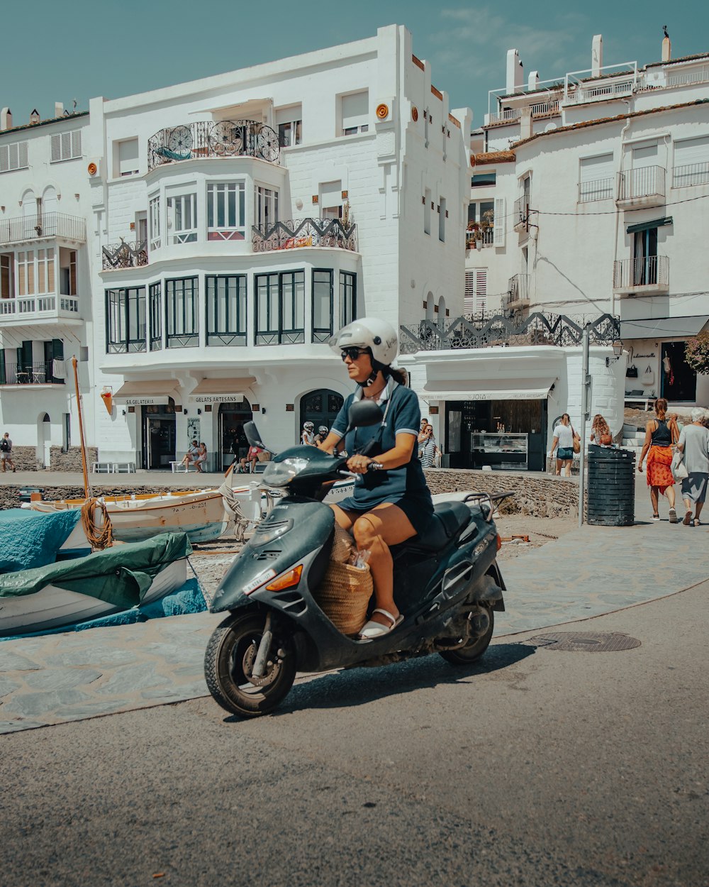  man in black jacket riding on black motor scooter