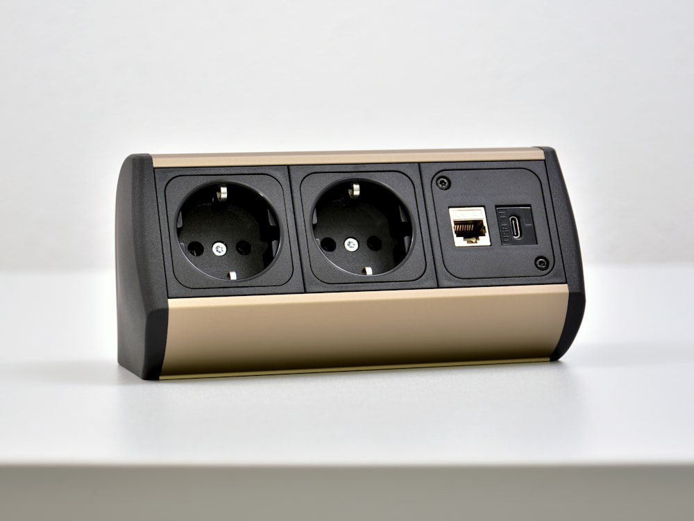 black and brown speaker on white table